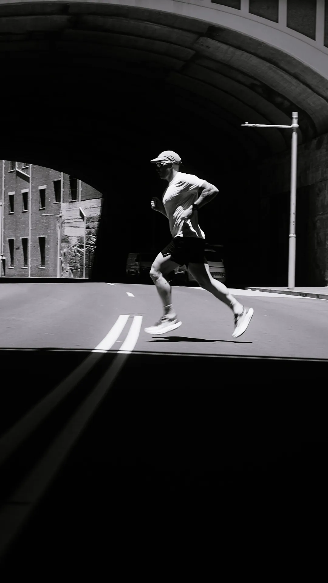 Matty Abel running in Sydney, black and white